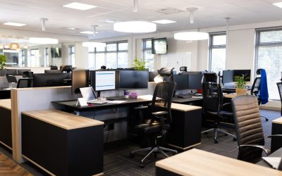 Empty open space office with desks, chairs and computers. Business, corporation and working in office concept.