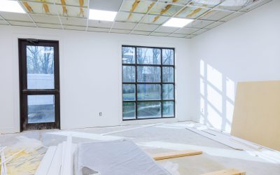 Making renovation of hung of suspended ceilings lights high in a bright modern office